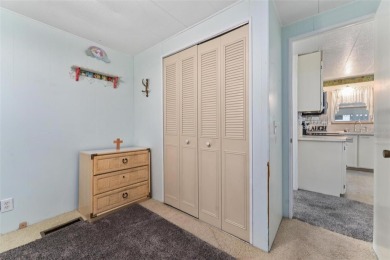 MOVE-IN READY! 2 BED/2 BATH COZY RETREAT - TWO FLORIDA ROOMS - on Bay Tree Golf Course in Florida - for sale on GolfHomes.com, golf home, golf lot