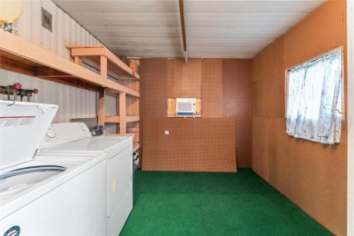 MOVE-IN READY! 2 BED/2 BATH COZY RETREAT - TWO FLORIDA ROOMS - on Bay Tree Golf Course in Florida - for sale on GolfHomes.com, golf home, golf lot