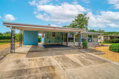 MOVE-IN READY! 2 BED/2 BATH COZY RETREAT - TWO FLORIDA ROOMS - on Bay Tree Golf Course in Florida - for sale on GolfHomes.com, golf home, golf lot