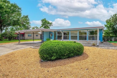 MOVE-IN READY! 2 BED/2 BATH COZY RETREAT - TWO FLORIDA ROOMS - on Bay Tree Golf Course in Florida - for sale on GolfHomes.com, golf home, golf lot