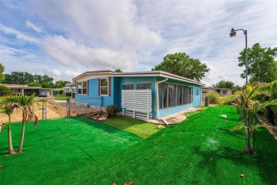 MOVE-IN READY! 2 BED/2 BATH COZY RETREAT - TWO FLORIDA ROOMS - on Bay Tree Golf Course in Florida - for sale on GolfHomes.com, golf home, golf lot