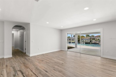COMPLETELY RENOVATED WATERFRONT OASIS! Nestled on a deep on Rocky Point Golf Course in Florida - for sale on GolfHomes.com, golf home, golf lot