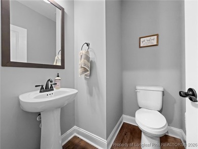 Welcome home to this well-maintained 4-bedroom, 2.5-bath on Woodlake Country Club in North Carolina - for sale on GolfHomes.com, golf home, golf lot