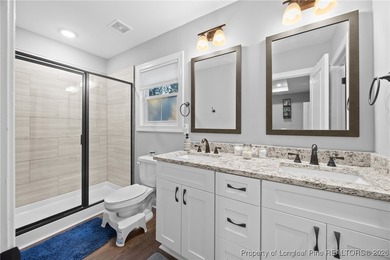 Welcome home to this well-maintained 4-bedroom, 2.5-bath on Woodlake Country Club in North Carolina - for sale on GolfHomes.com, golf home, golf lot