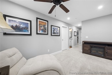 Welcome home to this well-maintained 4-bedroom, 2.5-bath on Woodlake Country Club in North Carolina - for sale on GolfHomes.com, golf home, golf lot