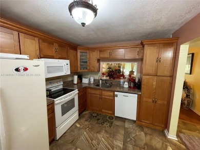 Welcome to this beautifully updated 2-bedroom, 2-bath apartment on Pembroke Lakes Golf Club in Florida - for sale on GolfHomes.com, golf home, golf lot