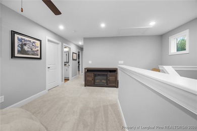 Welcome home to this well-maintained 4-bedroom, 2.5-bath on Woodlake Country Club in North Carolina - for sale on GolfHomes.com, golf home, golf lot