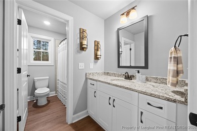 Welcome home to this well-maintained 4-bedroom, 2.5-bath on Woodlake Country Club in North Carolina - for sale on GolfHomes.com, golf home, golf lot