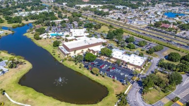 Enjoy easy living in this charming 2-bedroom, 2-bath end unit on Kings Point Executive Golf Course in Florida - for sale on GolfHomes.com, golf home, golf lot