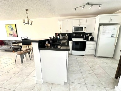 Beautiful, spacious and bright, this 1 1/2  fully furnished on Colony West Country Club in Florida - for sale on GolfHomes.com, golf home, golf lot