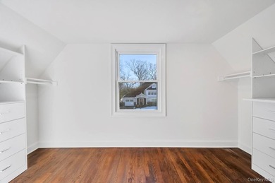 Set on a rare double lot in the Nassau Shores section of on Peninsula Golf Club in New York - for sale on GolfHomes.com, golf home, golf lot