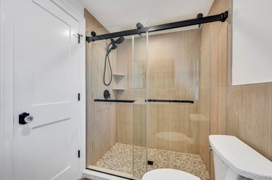 Set on a rare double lot in the Nassau Shores section of on Peninsula Golf Club in New York - for sale on GolfHomes.com, golf home, golf lot