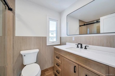 Set on a rare double lot in the Nassau Shores section of on Peninsula Golf Club in New York - for sale on GolfHomes.com, golf home, golf lot