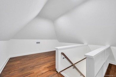 Set on a rare double lot in the Nassau Shores section of on Peninsula Golf Club in New York - for sale on GolfHomes.com, golf home, golf lot