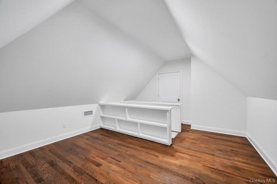 Set on a rare double lot in the Nassau Shores section of on Peninsula Golf Club in New York - for sale on GolfHomes.com, golf home, golf lot