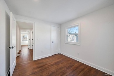 Set on a rare double lot in the Nassau Shores section of on Peninsula Golf Club in New York - for sale on GolfHomes.com, golf home, golf lot