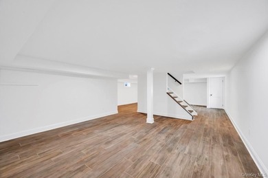 Set on a rare double lot in the Nassau Shores section of on Peninsula Golf Club in New York - for sale on GolfHomes.com, golf home, golf lot