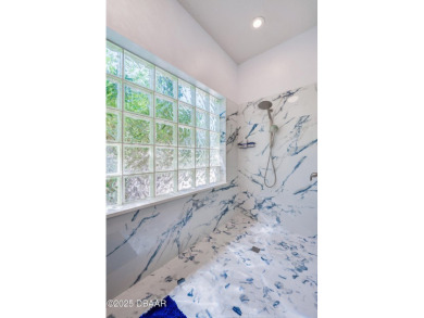 WOW! Look at that AMAZING outdoor living space with a stunning on LPGA International Golf Course in Florida - for sale on GolfHomes.com, golf home, golf lot