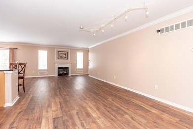 Welcome to this desirable single-level ranch in Fairways of on Whispering Pines Golf  in Michigan - for sale on GolfHomes.com, golf home, golf lot