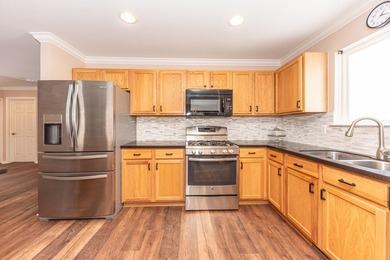 Welcome to this desirable single-level ranch in Fairways of on Whispering Pines Golf  in Michigan - for sale on GolfHomes.com, golf home, golf lot