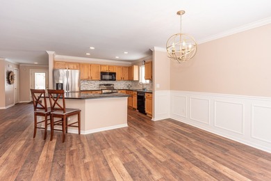 Welcome to this desirable single-level ranch in Fairways of on Whispering Pines Golf  in Michigan - for sale on GolfHomes.com, golf home, golf lot