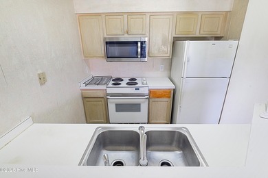 Opportunity knocks with this 1-bedroom condo in a gated golf on Brunswick Plantation and Golf Resorts in North Carolina - for sale on GolfHomes.com, golf home, golf lot