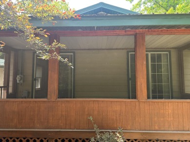 This well kept 2 bedroom is in a great location with paved road on Marquette Trails Country Club in Michigan - for sale on GolfHomes.com, golf home, golf lot