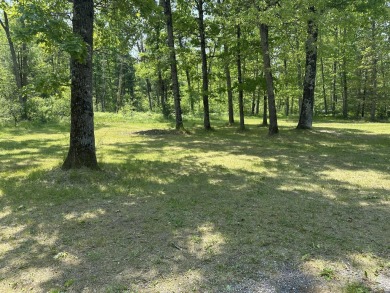 This well kept 2 bedroom is in a great location with paved road on Marquette Trails Country Club in Michigan - for sale on GolfHomes.com, golf home, golf lot