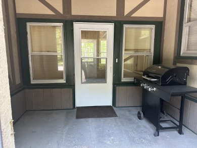 This well kept 2 bedroom is in a great location with paved road on Marquette Trails Country Club in Michigan - for sale on GolfHomes.com, golf home, golf lot