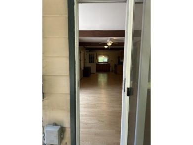 This well kept 2 bedroom is in a great location with paved road on Marquette Trails Country Club in Michigan - for sale on GolfHomes.com, golf home, golf lot