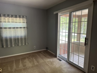 This well kept 2 bedroom is in a great location with paved road on Marquette Trails Country Club in Michigan - for sale on GolfHomes.com, golf home, golf lot
