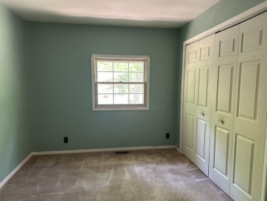 This well kept 2 bedroom is in a great location with paved road on Marquette Trails Country Club in Michigan - for sale on GolfHomes.com, golf home, golf lot