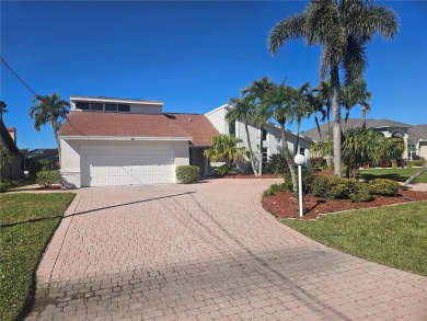 Welcome to your luxury waterfront oasis in Cape Coral! This on Royal Tee Country Club in Florida - for sale on GolfHomes.com, golf home, golf lot