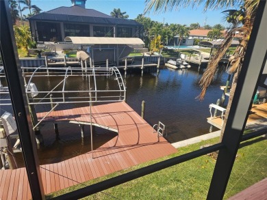 Welcome to your luxury waterfront oasis in Cape Coral! This on Royal Tee Country Club in Florida - for sale on GolfHomes.com, golf home, golf lot