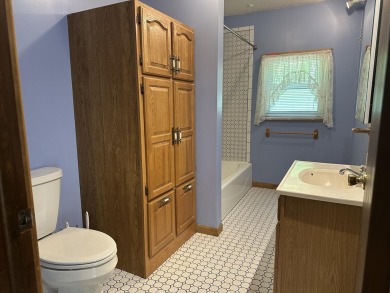 This well kept 2 bedroom is in a great location with paved road on Marquette Trails Country Club in Michigan - for sale on GolfHomes.com, golf home, golf lot