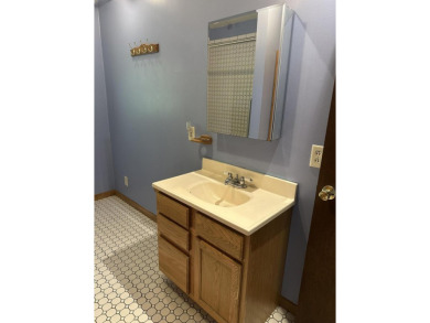 This well kept 2 bedroom is in a great location with paved road on Marquette Trails Country Club in Michigan - for sale on GolfHomes.com, golf home, golf lot
