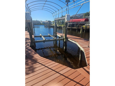 Welcome to your luxury waterfront oasis in Cape Coral! This on Royal Tee Country Club in Florida - for sale on GolfHomes.com, golf home, golf lot