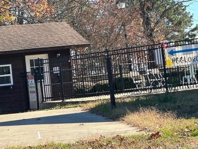 Enjoy lake life, free ATV/UTV trails, hiking, biking, tennis on Mountain Ranch Golf Club in Arkansas - for sale on GolfHomes.com, golf home, golf lot