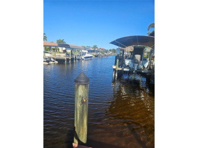 Welcome to your luxury waterfront oasis in Cape Coral! This on Royal Tee Country Club in Florida - for sale on GolfHomes.com, golf home, golf lot