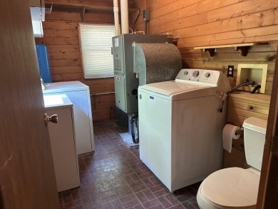 This well kept 2 bedroom is in a great location with paved road on Marquette Trails Country Club in Michigan - for sale on GolfHomes.com, golf home, golf lot