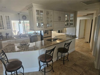 Welcome to your luxury waterfront oasis in Cape Coral! This on Royal Tee Country Club in Florida - for sale on GolfHomes.com, golf home, golf lot