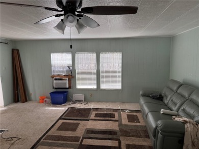Fixer Upper! Needs TLC! This 960-square-foot doublewide home in on Twin Isles Country Club in Florida - for sale on GolfHomes.com, golf home, golf lot