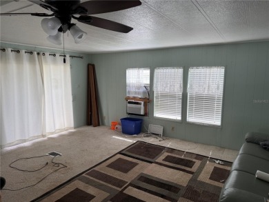 Fixer Upper! Needs TLC! This 960-square-foot doublewide home in on Twin Isles Country Club in Florida - for sale on GolfHomes.com, golf home, golf lot