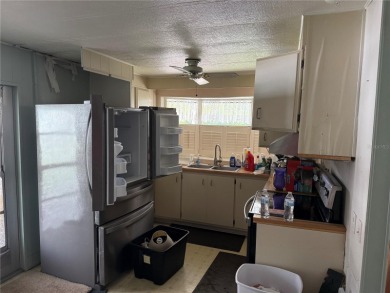 Fixer Upper! Needs TLC! This 960-square-foot doublewide home in on Twin Isles Country Club in Florida - for sale on GolfHomes.com, golf home, golf lot