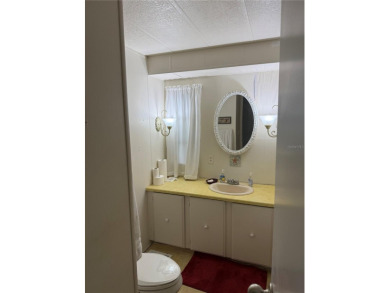 Fixer Upper! Needs TLC! This 960-square-foot doublewide home in on Twin Isles Country Club in Florida - for sale on GolfHomes.com, golf home, golf lot