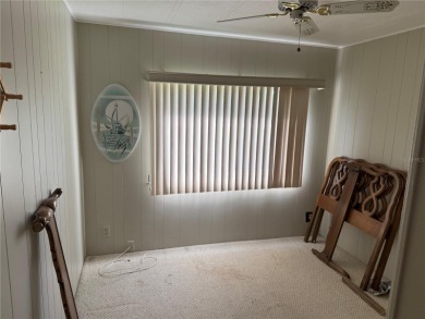 Fixer Upper! Needs TLC! This 960-square-foot doublewide home in on Twin Isles Country Club in Florida - for sale on GolfHomes.com, golf home, golf lot