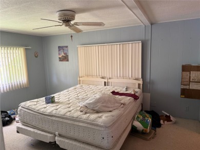Fixer Upper! Needs TLC! This 960-square-foot doublewide home in on Twin Isles Country Club in Florida - for sale on GolfHomes.com, golf home, golf lot