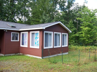 Double Lot, Year round home on private, wooded setting. Located on Burning Oak Country Club in Michigan - for sale on GolfHomes.com, golf home, golf lot