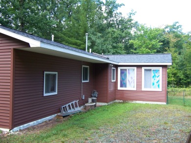 Double Lot, Year round home on private, wooded setting. Located on Burning Oak Country Club in Michigan - for sale on GolfHomes.com, golf home, golf lot