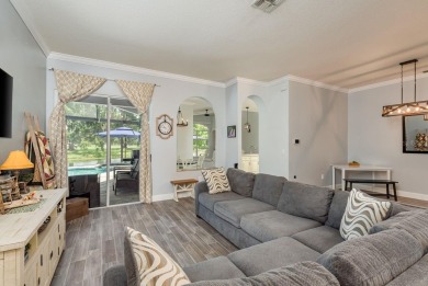 Experience refined Florida living at its finest in this on The Eagles Golf Course and Club in Florida - for sale on GolfHomes.com, golf home, golf lot